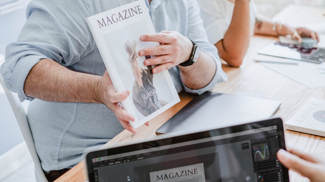 Creative people working on magazine cover design