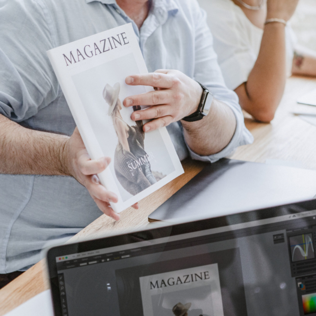 Creative people working on magazine cover design