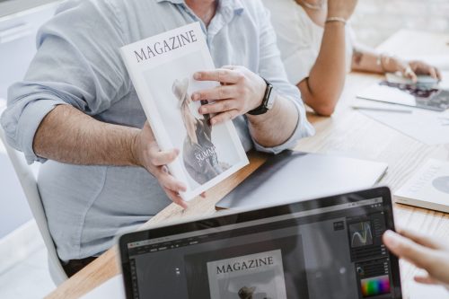 Creative people working on magazine cover design